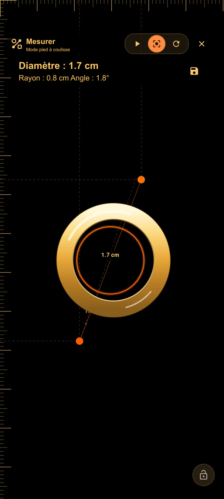 SIMT Measure en mode Caliper avec une bague posée sur l’écran du téléphone et la ligne du pied à coulisse traversant son diamètre intérieur, avec les valeurs du diamètre et du rayon