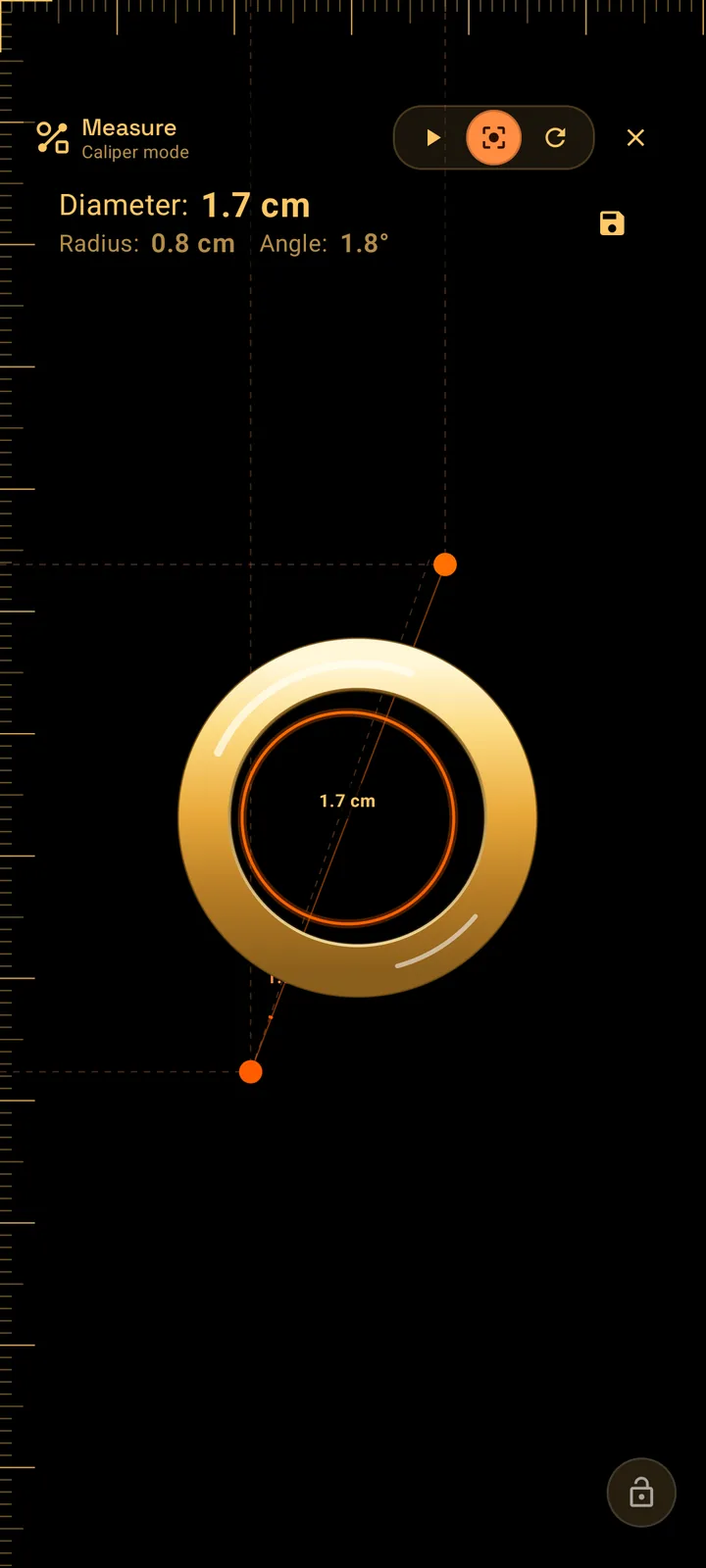 SIMT Measure in Caliper mode with a ring laid on the phone screen and the caliper line spanning its inner diameter, showing a diameter and radius readout