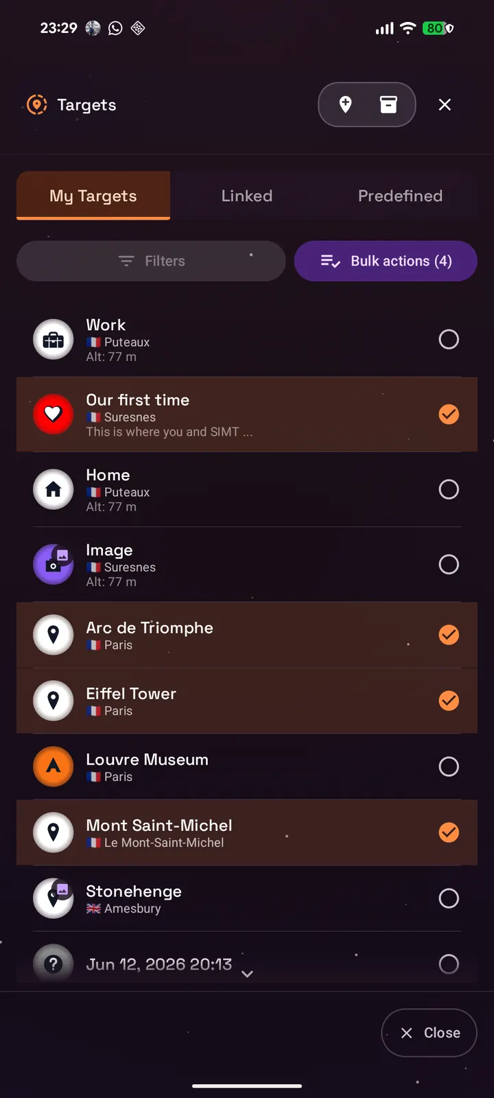 SIMT My Targets list in selection mode with four targets ticked, including Our first time, Arc de Triomphe, Eiffel Tower, and Mont Saint-Michel, and a purple Bulk actions (4) button above the rows next to Filters